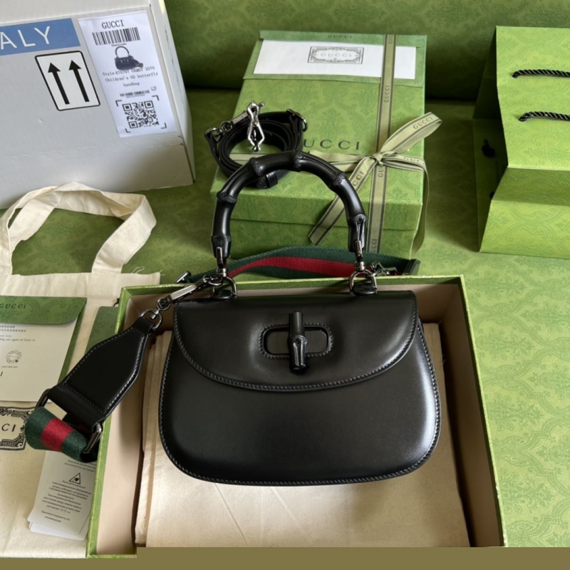G*u*i top handle bags
